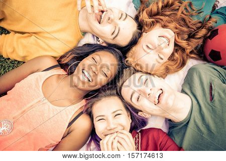 Group of friends laughing out loud outdoor sharing good and positive mood.