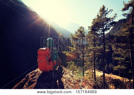 young woman backpacker enjoy the sunrise at the himalaya mountains