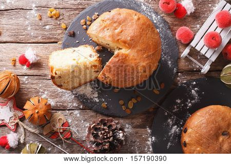 Christmas Panettone Bread With Dried Fruit And Festive Decoration Close-up. Horizontal Top View
