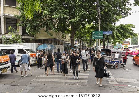 BANGKOK THAILAND - OCT 19 : scene of people at Ratchadamnoen Klang Road near Sanam Luang while the funeral of king Bhumibol Adulyadej in Grand Palace on october 19 2016