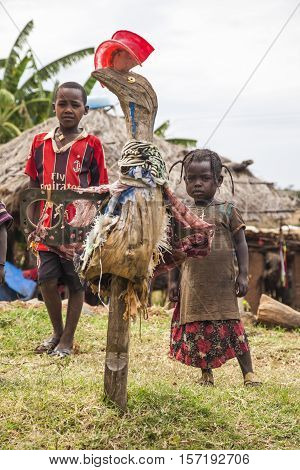 OMO VALLEY. ETHIOPIA - JANUARY 2 2014: Unidentified local children in local gallery of sculptures made from recycled materials.