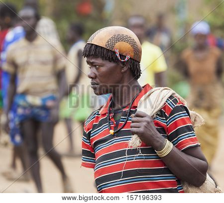 Ari Woman In Calabash Hat/helmet At Village Market. Bonata. Omo Valley. Ethiopia.