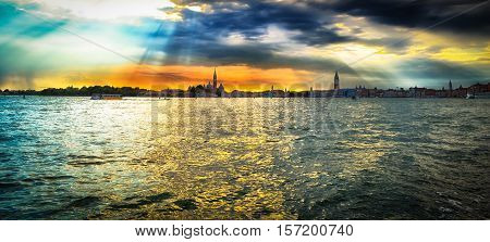 A beautiful colorful sunset over the sea in Venice. Traveling in boat near Venice at sunset.