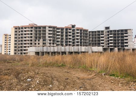 Abandoned Construction Of Multi-storey Residential Complex, Overgrown With Weeds