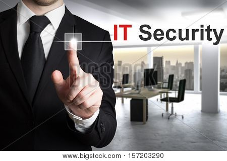 businessman in office pushing button it security