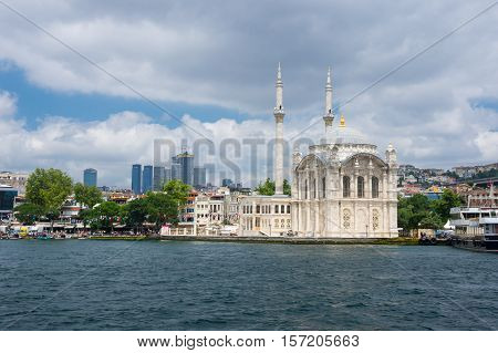 ISTANBUL TURKEY - JUNE 25 2015: Ortaköy Mosque (Grand Imperial Mosque of Sultan Abdulmecid) in Istanbul Turkey is situated at the waterside of the Ortakoy pier square one of the most popular locations on the Bosphorus