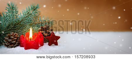 Christmas background with red advent candle and green fir tree bransh .Christmas background.