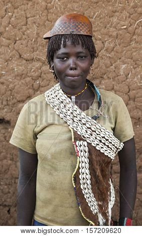 Banna Woman In Calabash Hat/helmet At Village Market. Key Afar. Omo Valley. Ethiopia.