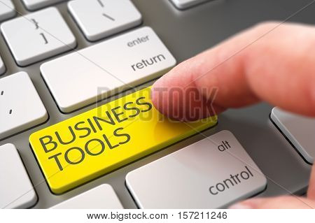 Business Concept - Male Finger Pointing Yellow Business Tools Button on Modernized Keyboard. 3D Render.