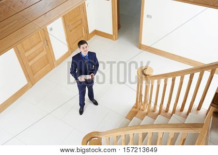 Male Realtor Looking Around Vacant New Property