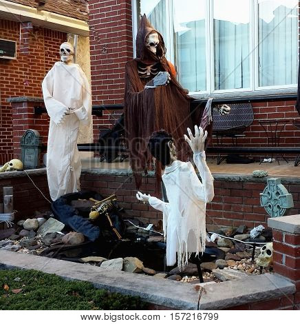 Halloween yard decorations ghosts and skeletons. Decoration for the holiday