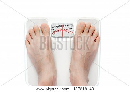 Feet On Mechanical Bathroom Scale Isolated On White
