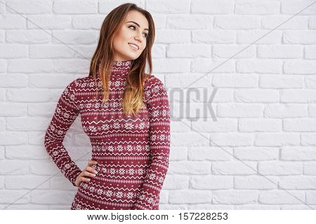 Charming Woman In Warm Sweater Looking Aside