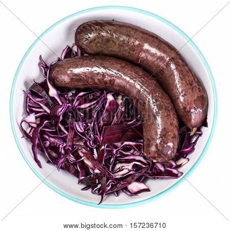 Homemade blood sausage with cabbage on a white background. Studio Photo
