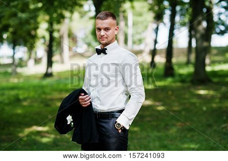 Trendy Beard Man Groom With Bow Tie Posed On Park.