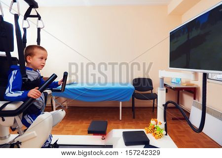 Young Boy Passes Robotic Gait Therapy In Rehabilitation Center