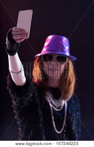 Woman Dressed As A Popstar Taking A Selfie