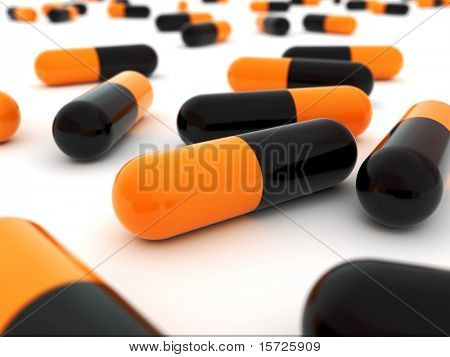 Nero - arancio Pills, close up. Concetto di veleno (pericolo)