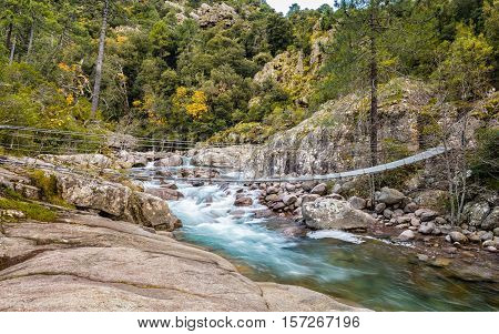 Steel Rope Bridge Across La Figarella At Bonifatu In Corsica