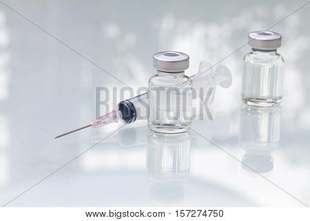 medical ampoules with syringe isolated on white background