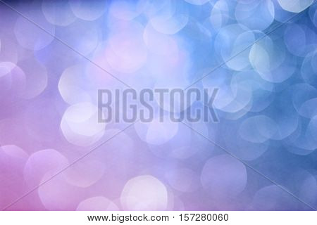 Blue and vilet Bokeh Background. Festive abstract background with bokeh lights. Blue Christmas Light. New Year's texture with gradient.