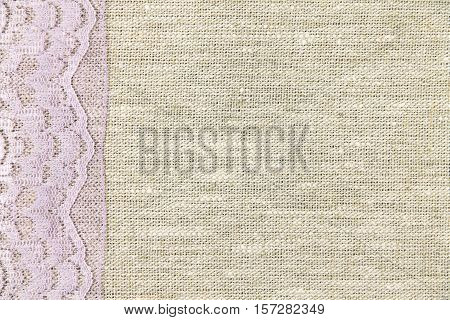 lilac lace on a gray fabric background