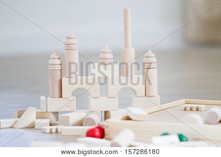 noname wooden bulding blocks, building castles and houses from wooden blocks at home