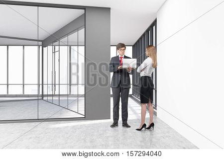 People are standing in an empty room with glass walls and concrete floor. Large panoramic windows. Concept of a new business. 3d rendering. Mock up