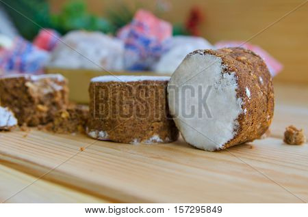 Close up of polvoron typical sweets consumed in Spain at Christmas. Spanish shortbread on wood background.Shallow depth of field