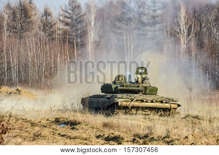 Russian tank shot on a forest road