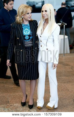 NEW YORK-MAY 5: Designer Donatella Versace (R) attends the ribbon cutting ceremony for the Anna Wintour Costume Center Grand Opening at the Metropolitan Museum of Art on May 5, 2014 in New York City.