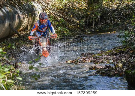 VLADIVOSTOK, RUSSIA - OCTOBER 10: competition On the edge 2016 Hard Enduro Rally with a KTM motorcycle. The hardest enduro rally in the world. October 10, 2016 in Vladivostok, Russia