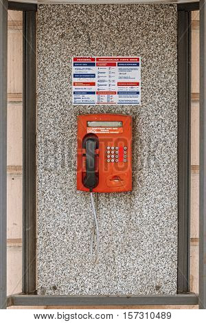St Petersburg Russia, 26 of Feb. 2016: Public pay phone of red color in phone booth