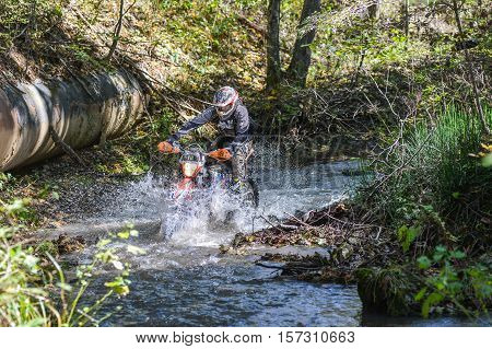VLADIVOSTOK, RUSSIA - OCTOBER 10: competition On the edge 2016 Hard Enduro Rally with a KTM motorcycle. The hardest enduro rally in the world. October 10, 2016 in Vladivostok, Russia
