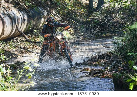 VLADIVOSTOK, RUSSIA - OCTOBER 10: competition On the edge 2016 Hard Enduro Rally with a KTM motorcycle. The hardest enduro rally in the world. October 10, 2016 in Vladivostok, Russia