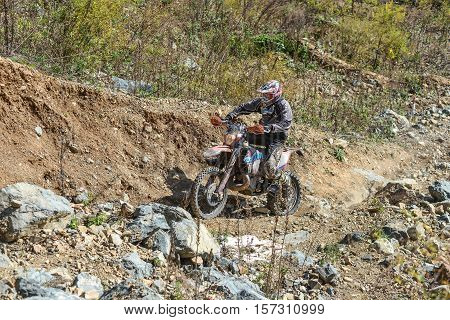 VLADIVOSTOK, RUSSIA - OCTOBER 10: competition On the edge 2016 Hard Enduro Rally with a KTM motorcycle. The hardest enduro rally in the world. October 10, 2016 in Vladivostok, Russia