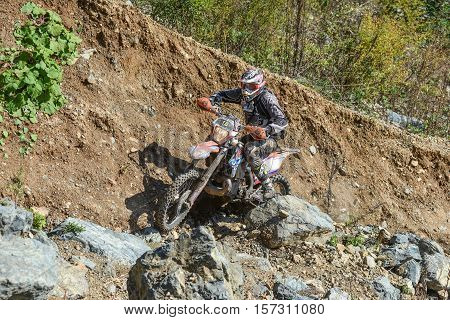 VLADIVOSTOK, RUSSIA - OCTOBER 10: competition On the edge 2016 Hard Enduro Rally with a KTM motorcycle. The hardest enduro rally in the world. October 10, 2016 in Vladivostok, Russia