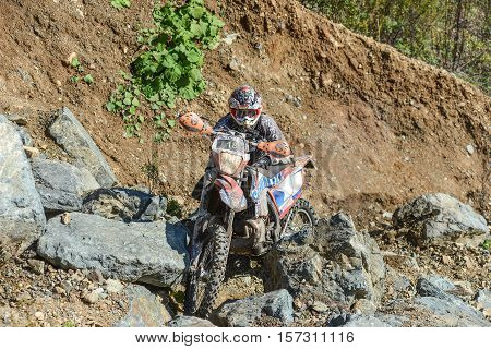 VLADIVOSTOK, RUSSIA - OCTOBER 10: competition On the edge 2016 Hard Enduro Rally with a KTM motorcycle. The hardest enduro rally in the world. October 10, 2016 in Vladivostok, Russia