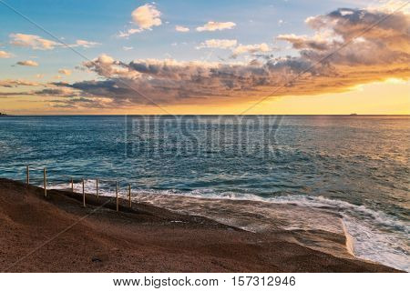 Rocks at topical beach at beautiful sunset.Costa Adeje, Tenerife, Spain
