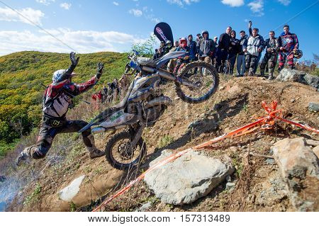 VLADIVOSTOK, RUSSIA - OCTOBER 10: competition On the edge 2016 Hard Enduro Rally with a KTM motorcycle. The hardest enduro rally in the world. October 10, 2016 in Vladivostok, Russia