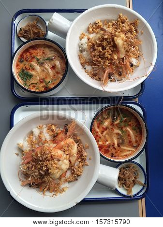 2 lunch sets of stir fry garlic pepper prawn with mushroom Tomyum soup in a top view