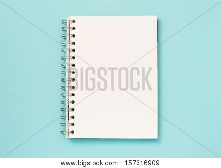 Top view of blank note paper blue wood table for background
