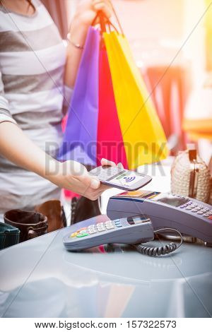 mobile payment phone retail nfc pay paying smart shopping reader woman wireless concept - stock image