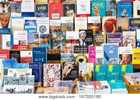 ORVAL BELGIUM - AUGUST 23 2016: Christian books for sale in the gift shop of the famous Orval Abbey in Belgian Ardennes