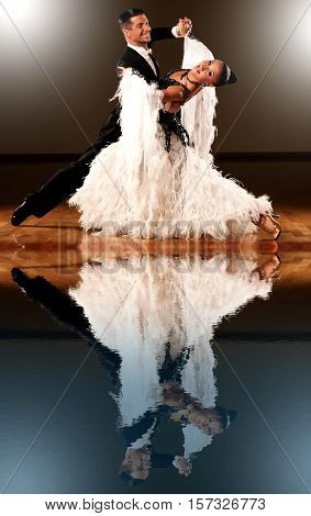 Professional ballroom dance couple preform an romantic exhibition dance