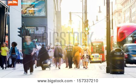 Blurred image of walking people. Londoners and tourists walking in Oxford street, one of the main shopping destination of London