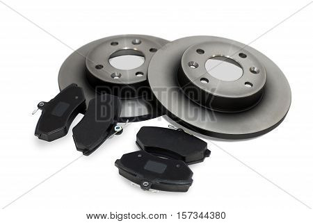 four brake pads and two new brake discs for the car