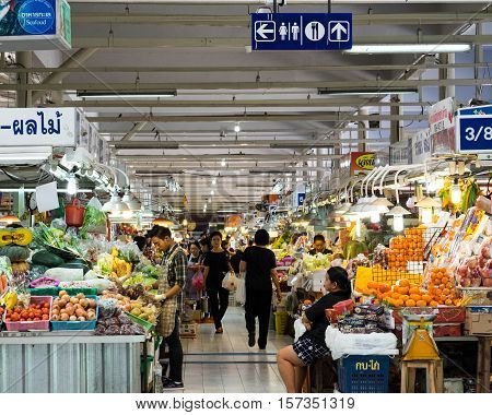 BANGKOKTHAILAND-NOV 16 : Monger sell fruit and Vegetable in a wet market ,November 16,2016 in BangkokThailand.