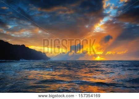 Smoke billows from Pacific Ocean at sunrise as molten lava flows into the Pacific Ocean outside Hilo, Hawaii