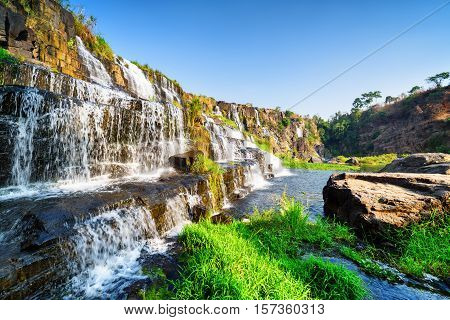 Side View Of Natural Cascading Waterfall With Crystal Water
